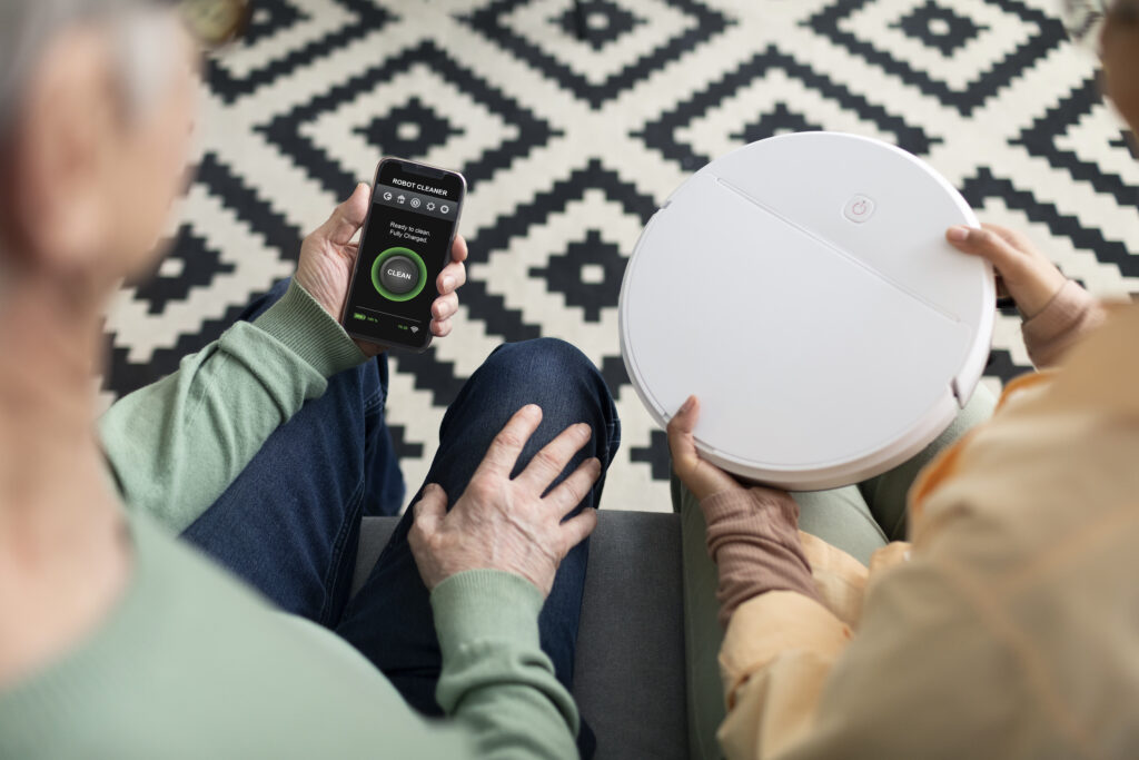 Senior using smart speaker for help for elderly in home with technology.
