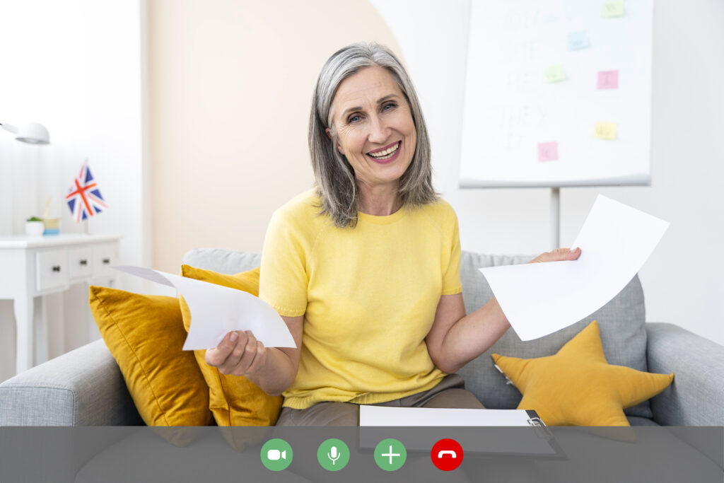 Elderly person video calling family for emotional help for elderly in home.