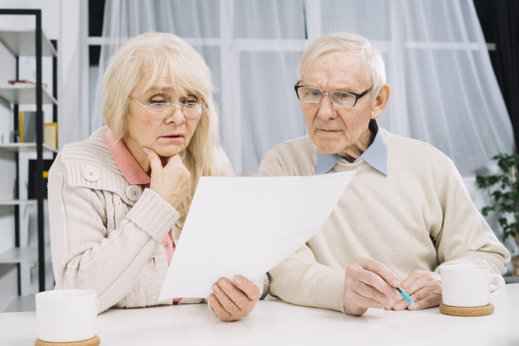 Senior couple discussing open care senior plan reviews for coverage